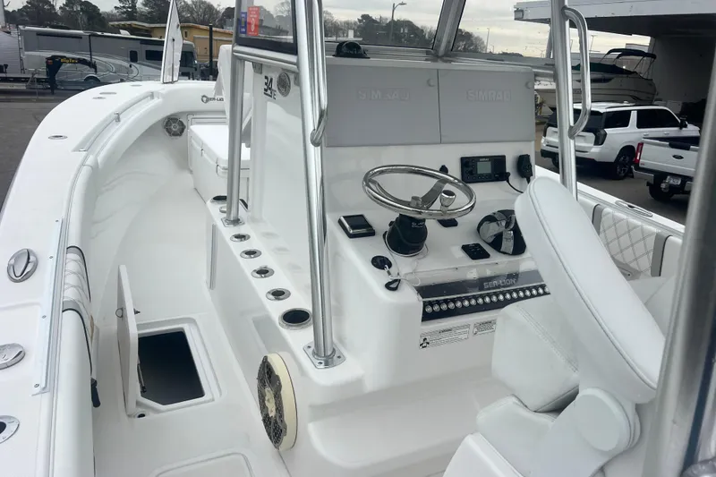 Slide: The Image of 2022 Sea-Lion 34 TE boat interior with steering console and seating area. - 15