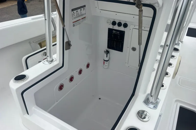 Slide: The Image of 2022 Sea-Lion 34 TE boat interior with control panel and storage area. - 22