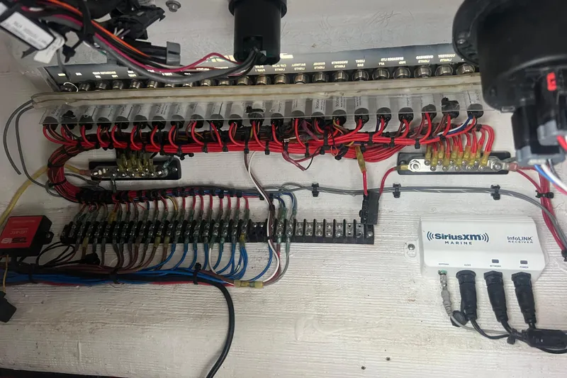 Slide: The Image of Electrical panel of 2022 Sea-Lion 34 TE boat with SiriusXM Marine receiver. - 24