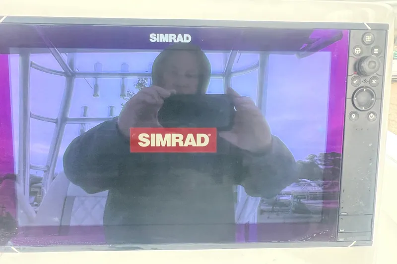 Slide: The Image of Simrad display on 2022 Sea-Lion 34 TE boat, reflecting a person taking a photo. - 28