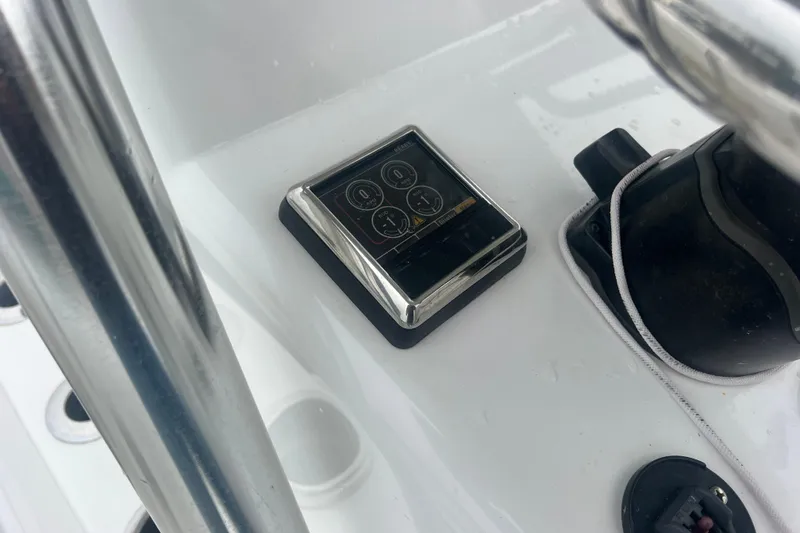 Slide: The Image of Control panel on 2022 Sea-Lion 34 TE boat dashboard with chrome accents. - 30