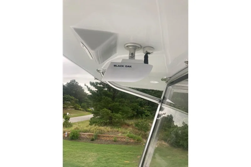 Slide: The Image of 2022 Sea-Lion 34 TE boat with Black Oak light fixture, outdoor setting. - 32