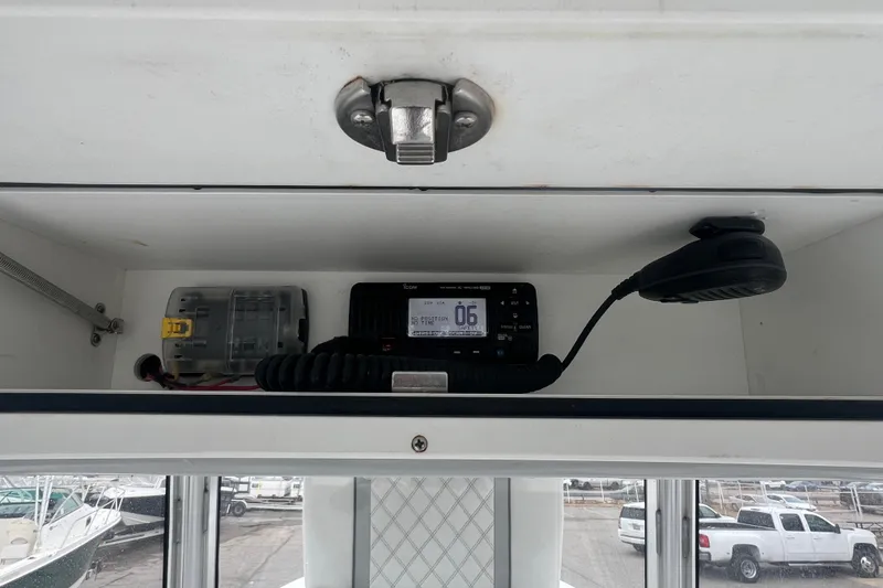 Slide: The Image of 2022 Sea-Lion 34 TE boat radio compartment with communication equipment and wiring. - 33
