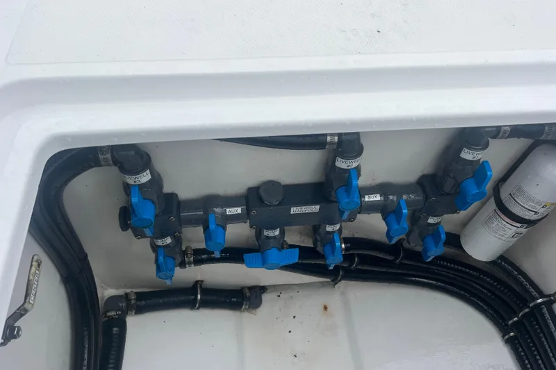 Slide: The Image of 2022 Sea-Lion 34 TE boat plumbing system with blue valves and labeled connections. - 37