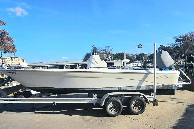 Slide: The Image of 2007 NauticStar 2110 Nautic Bay boat on trailer at marina. - 3