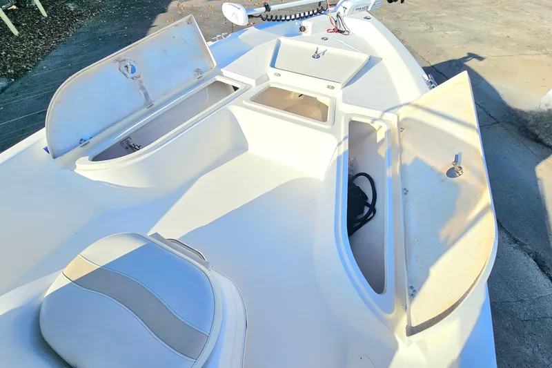 Slide: The Image of 2007 NauticStar 2110 Nautic Bay boat interior with open storage compartments. - 7