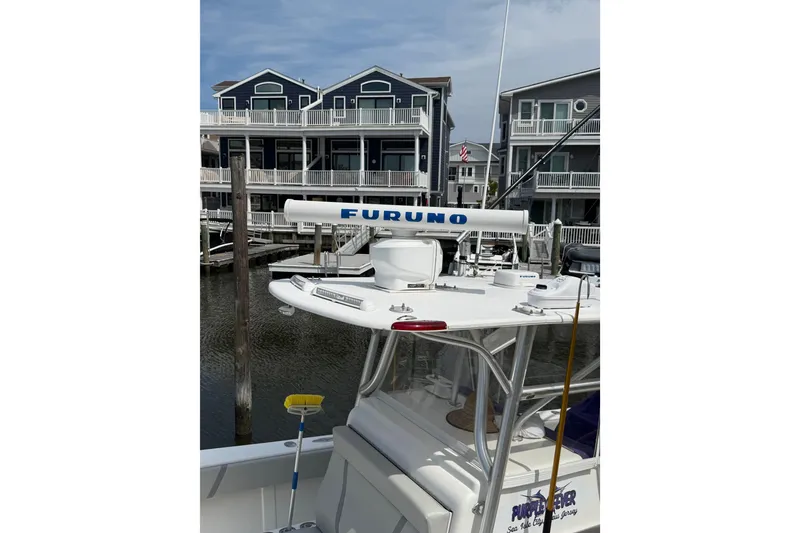 Slide: The Image of 2006 SeaVee 340B boat with Furuno radar, docked near waterfront homes. - 15