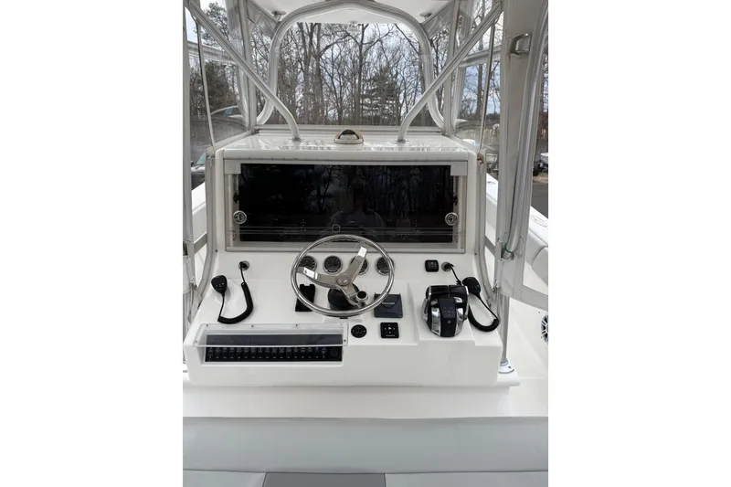 Slide: The Image of Helm of 2006 SeaVee 340B boat with steering wheel and controls. - 28