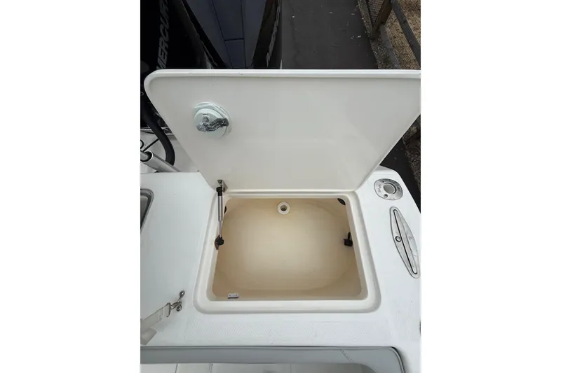 Slide: The Image of Open storage compartment on a 2006 SeaVee 340B boat, showcasing interior space. - 36