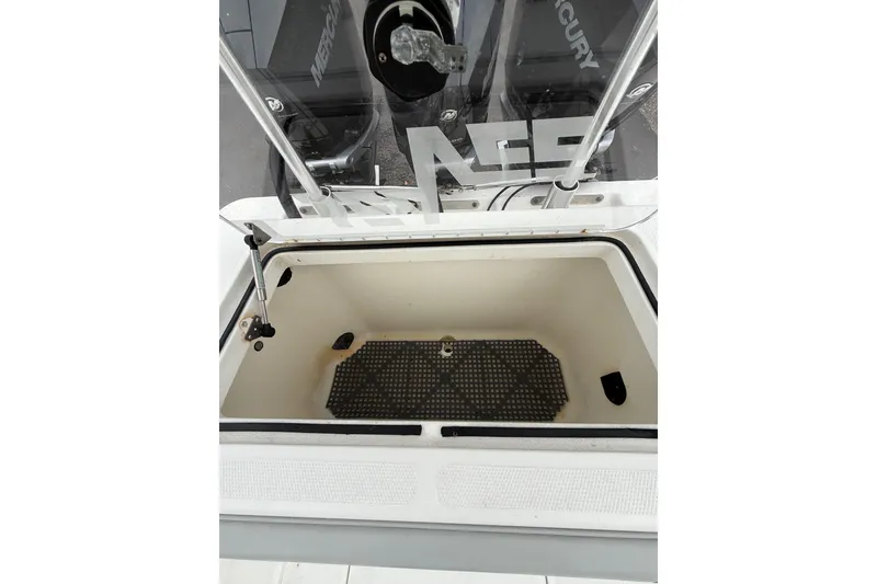 Slide: The Image of Open storage compartment on a 2006 SeaVee 340B boat, featuring a clean interior. - 37