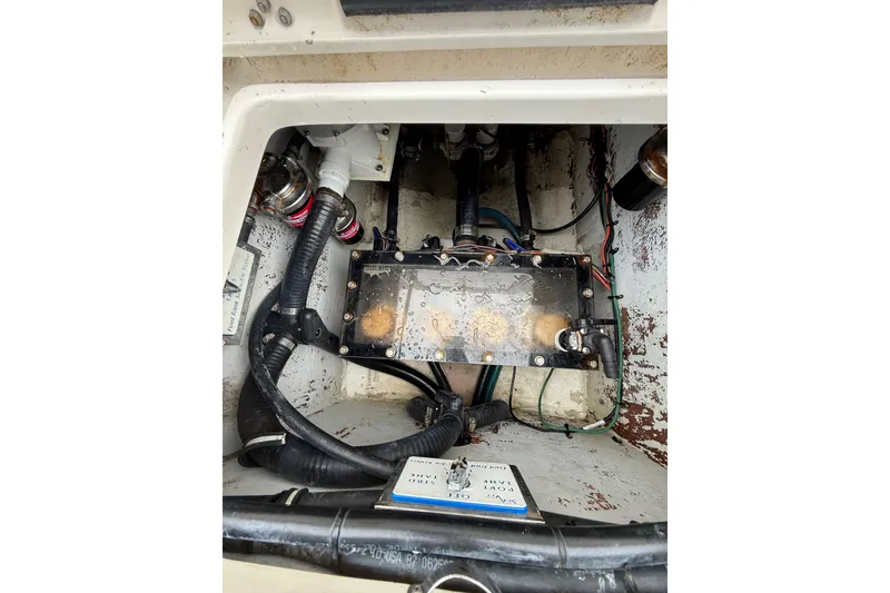 Slide: The Image of 2006 SeaVee 340B boat interior showing engine compartment with wiring and components. - 39