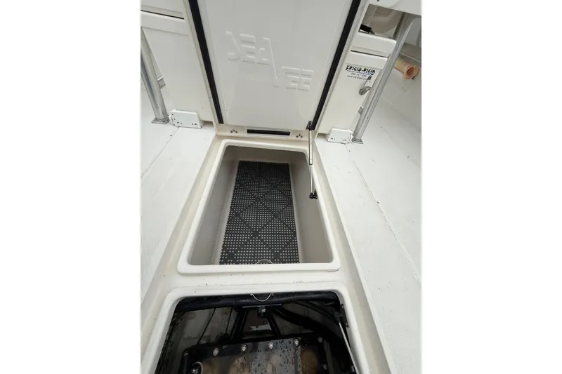 Slide: The Image of 2006 SeaVee 340B boat storage compartment with open hatch and visible interior. - 40