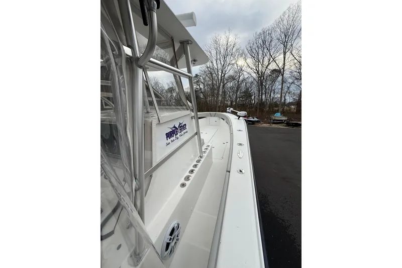 Slide: The Image of 2006 SeaVee 340B boat side view, showcasing sleek design and sturdy construction. - 47