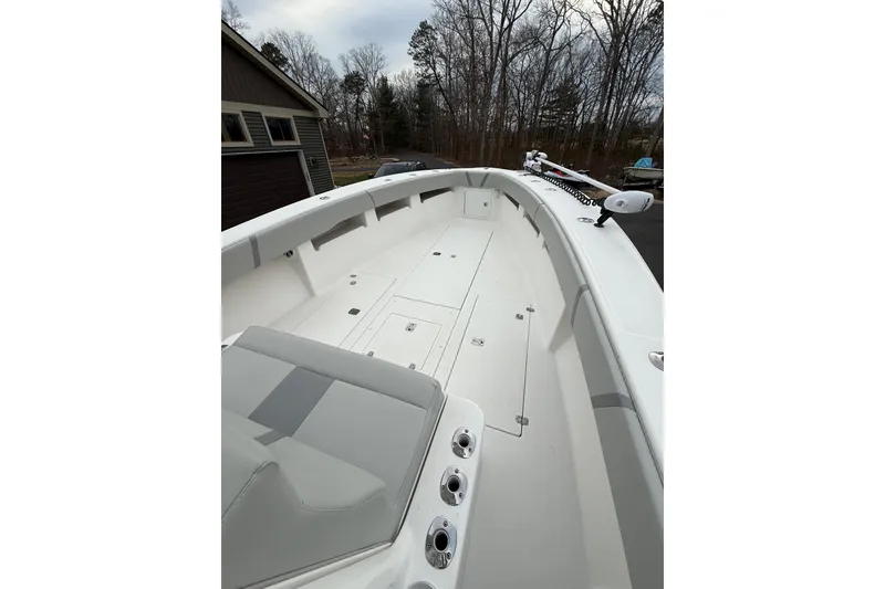 Slide: The Image of 2006 SeaVee 340B boat deck with seating, storage, and fishing rod holders. - 49