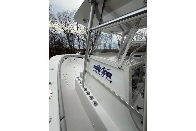 Slide: The Image of 2006 SeaVee 340B boat deck with sleek design and sturdy railings. - 52