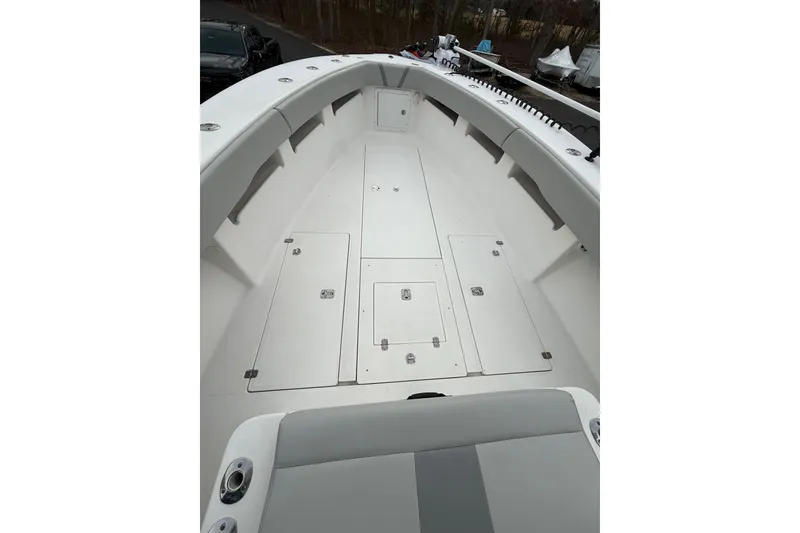 Slide: The Image of 2006 SeaVee 340B boat deck with storage compartments and seating. - 54