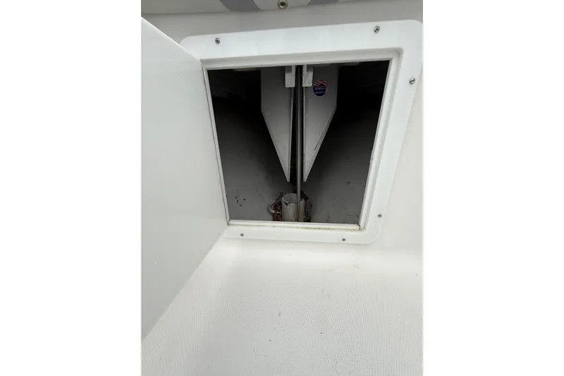 Slide: The Image of Open hatch on 2006 SeaVee 340B boat, revealing interior compartment. - 57