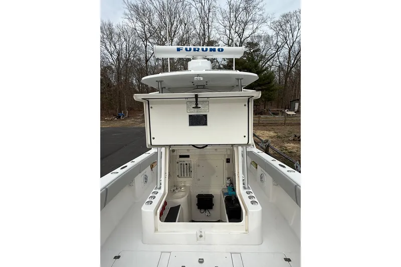 Slide: The Image of 2006 SeaVee 340B boat with Furuno radar, open hatch, and wooded background. - 64
