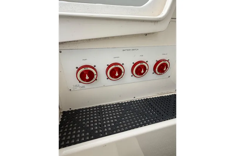 Slide: The Image of Battery switches on a 2006 SeaVee 340B boat control panel. - 66