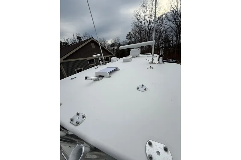 Slide: The Image of Rooftop view of a 2006 SeaVee 340B boat with antennas and fixtures. - 72