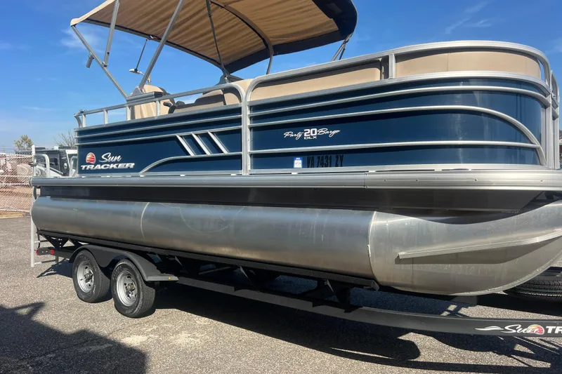Slide: The Image of 2023 Sun Tracker Party Barge 20 DLX pontoon boat with canopy on trailer. - 11