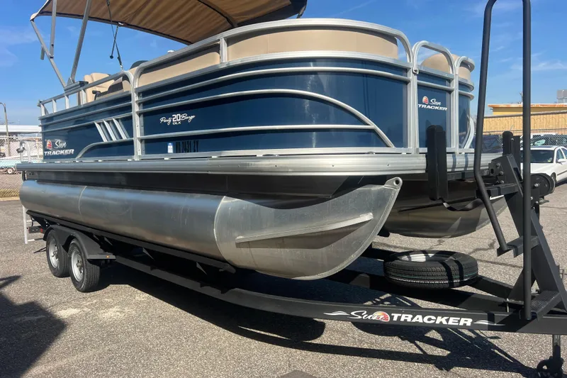 Slide: The Image of 2023 Sun Tracker Party Barge 20 DLX pontoon boat on trailer. - 12