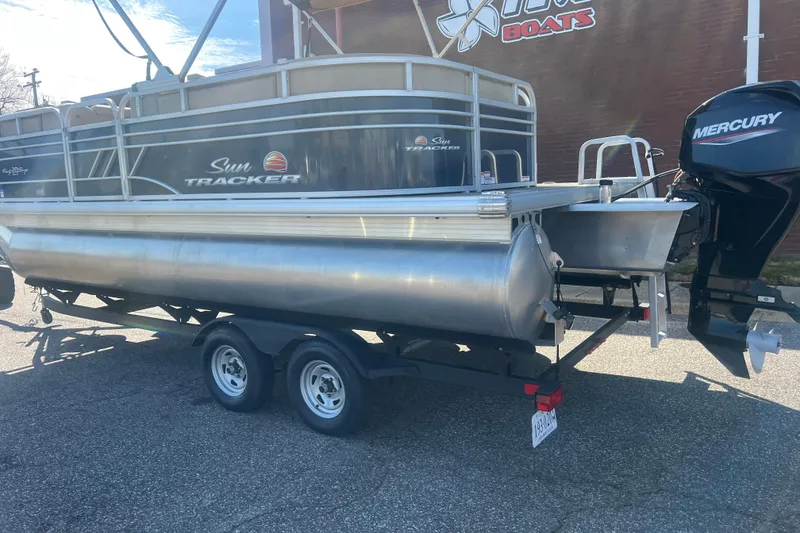 Slide: The Image of 2023 Sun Tracker Party Barge 20 DLX pontoon boat on trailer with Mercury outboard motor. - 3