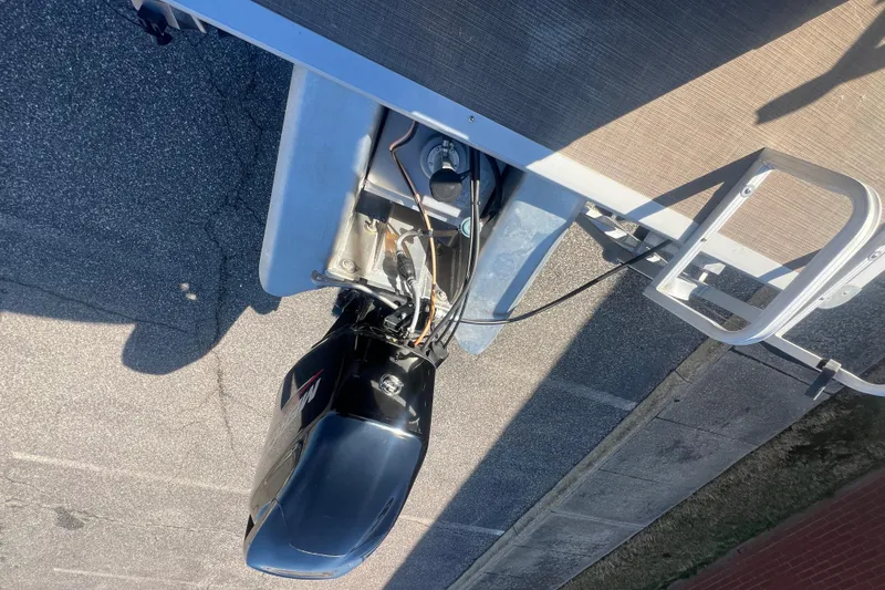 Slide: The Image of 2023 Sun Tracker Party Barge 20 DLX with outboard motor, viewed from above. - 32