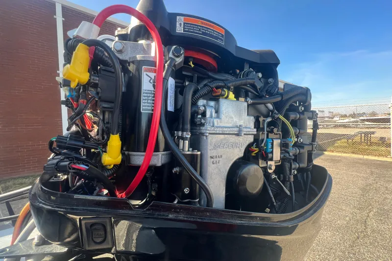 Slide: The Image of 2023 Sun Tracker Party Barge 20 DLX engine, detailed view with wiring and components. - 34