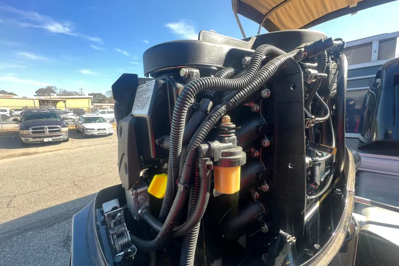 Slide: The Image of 2023 Sun Tracker Party Barge 20 DLX engine close-up, showcasing intricate wiring and components. - 35