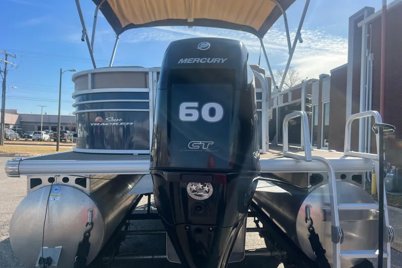 Slide: The Image of 2023 Sun Tracker Party Barge 20 DLX with Mercury 60 engine, docked outdoors. - 5