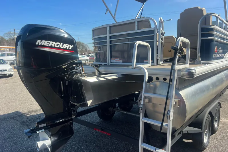 Slide: The Image of 2023 Sun Tracker Party Barge 20 DLX with Mercury outboard motor and trailer. - 6