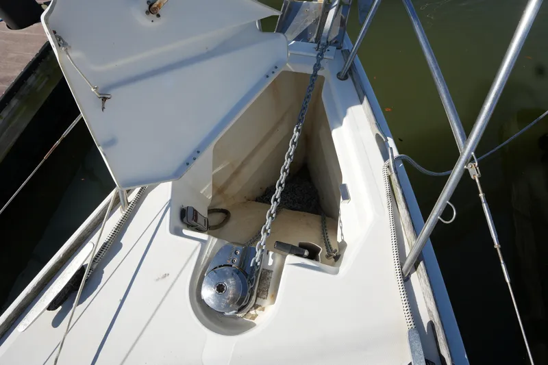Slide: The Image of Anchor locker of 2009 Jeanneau Sun Odyssey 36i sailboat with chain and winch. - 12