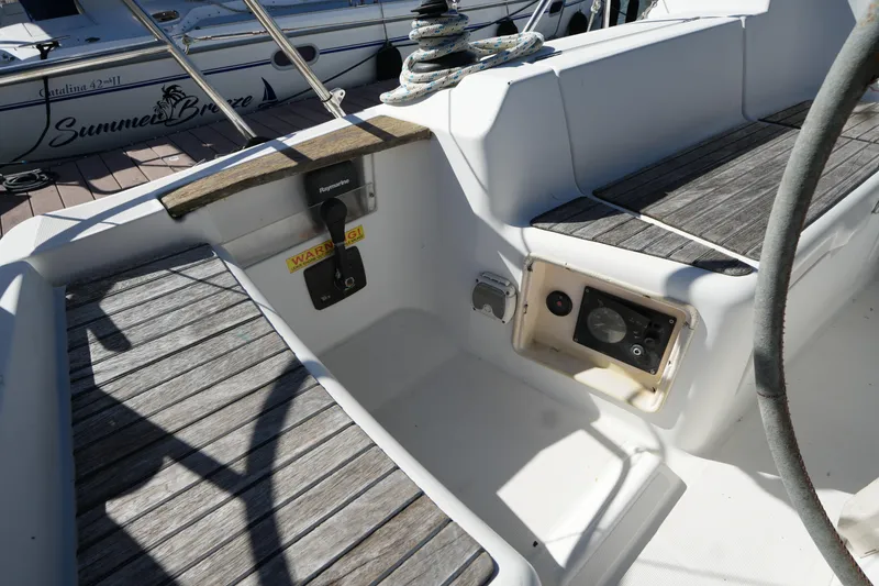 Slide: The Image of Cockpit of 2009 Jeanneau Sun Odyssey 36i sailboat with wooden flooring and control panel. - 14