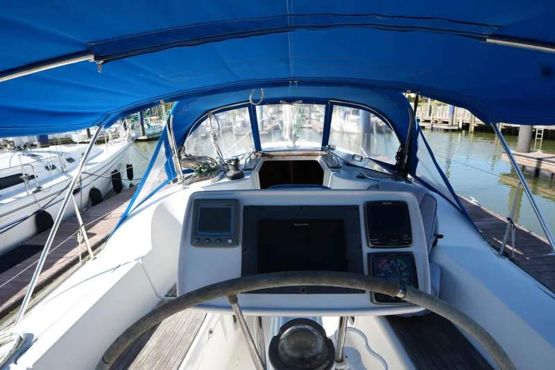 Slide: The Image of Cockpit view of 2009 Jeanneau Sun Odyssey 36i sailboat with blue canopy. - 15