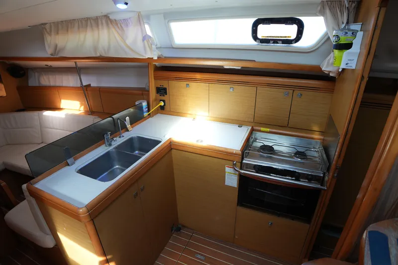 Slide: The Image of Interior of 2009 Jeanneau Sun Odyssey 36i yacht kitchen with sink and stove. - 22