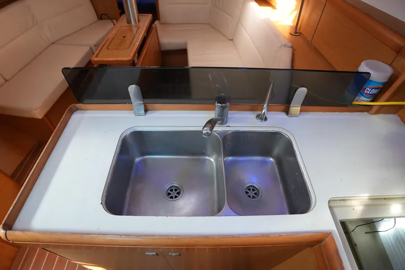 Slide: The Image of Interior of 2009 Jeanneau Sun Odyssey 36i yacht with dual kitchen sinks. - 23