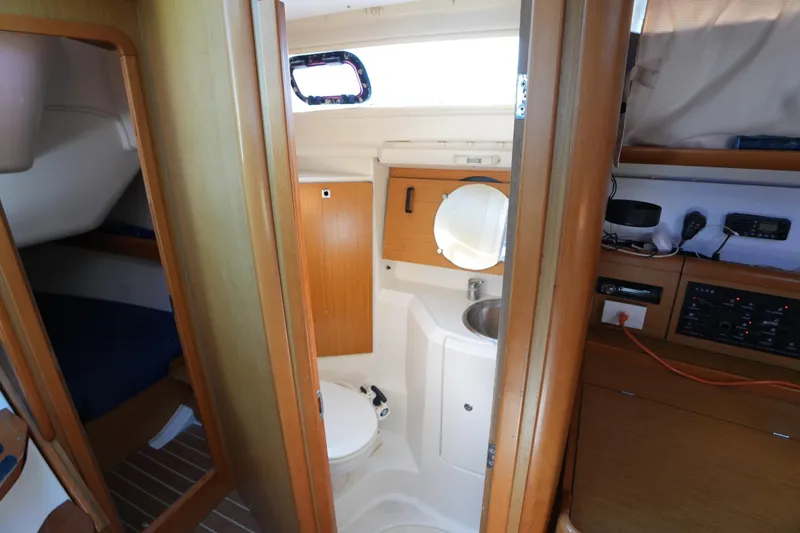 Slide: The Image of Interior of 2009 Jeanneau Sun Odyssey 36i yacht, featuring bathroom and cabin area. - 25
