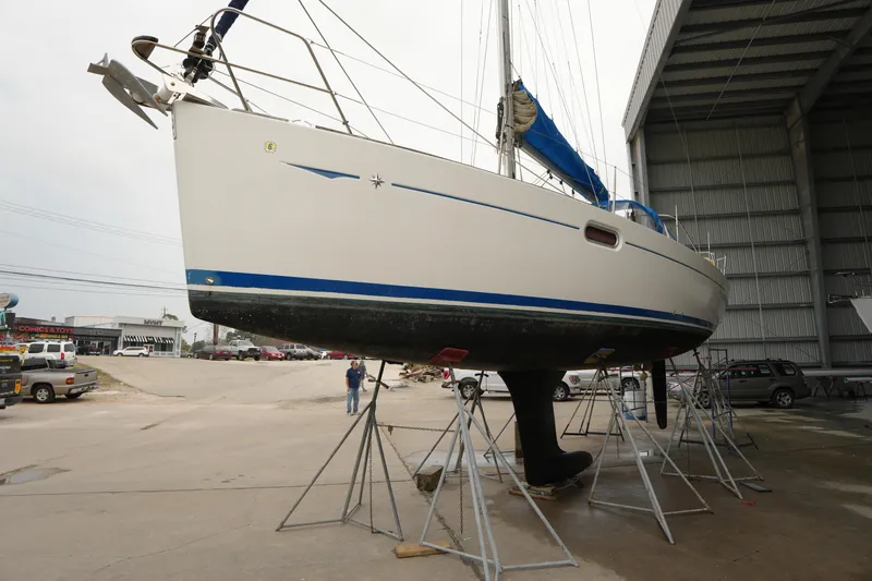 Slide: The Image of 2009 Jeanneau Sun Odyssey 36i sailboat on stands in a boatyard. - 5