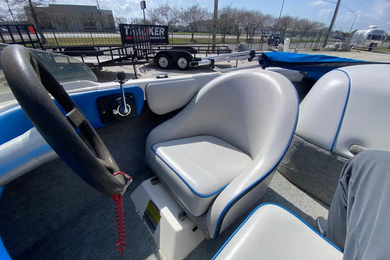 Slide: The Image of 1997 Malibu Tantrum boat interior with steering wheel and seating. - 21