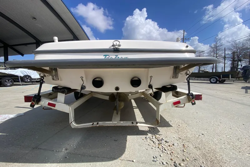 Slide: The Image of 1997 Malibu Tantrum boat on trailer under clear blue sky. - 5
