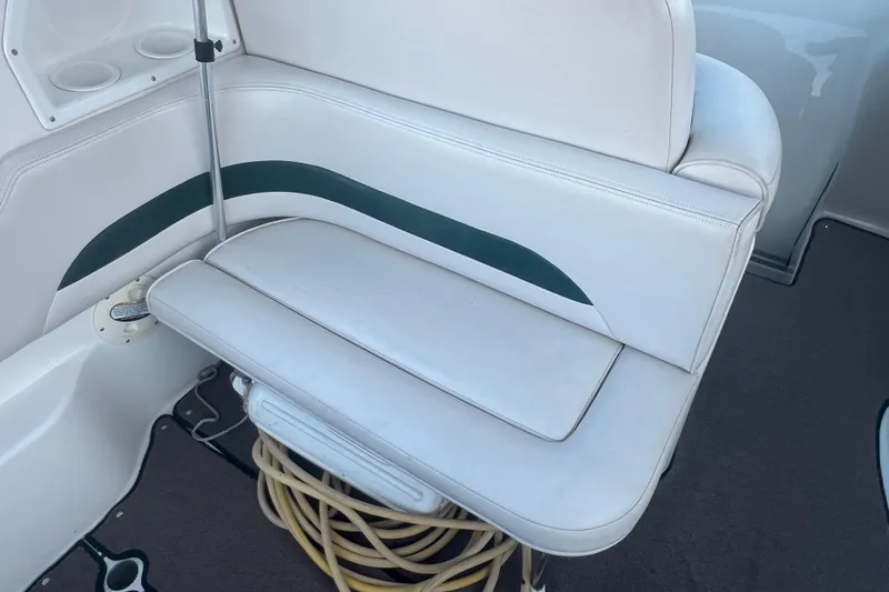 Slide: The Image of 2001 Chaparral Signature 260 boat interior with white seating and cup holders. - 14