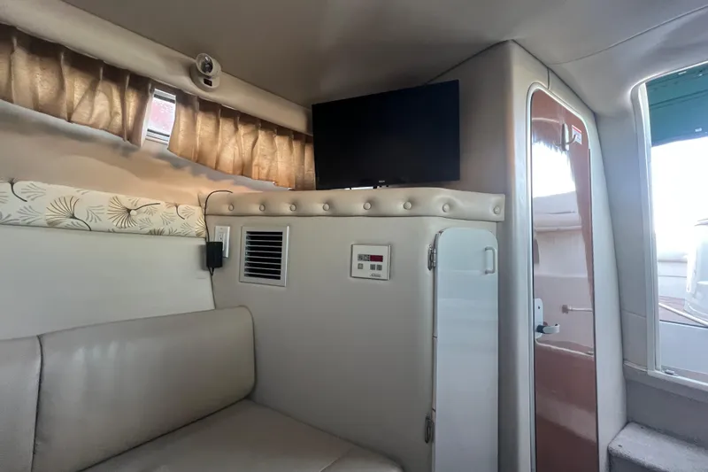 Slide: The Image of Interior of 2001 Chaparral Signature 260 boat with TV and seating area. - 22