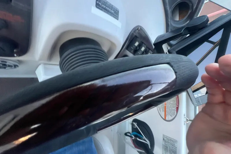 Slide: The Image of Steering wheel of a 2001 Chaparral Signature 260 boat, close-up view. - 30