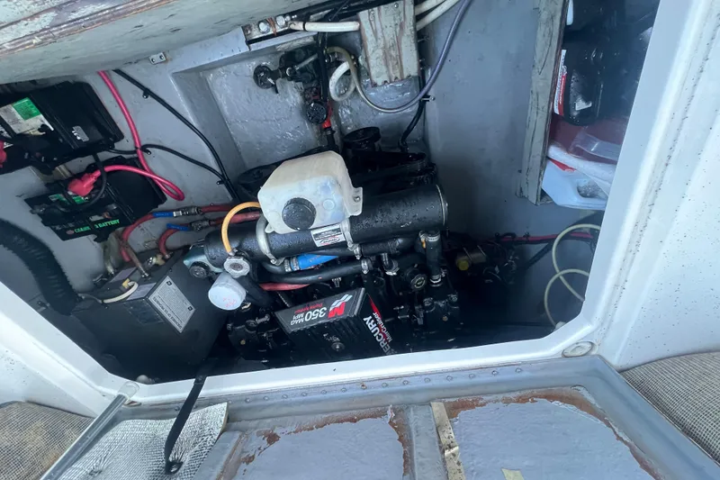 Slide: The Image of Engine compartment of a 2001 Chaparral Signature 260 boat, featuring a MerCruiser 350 MAG MPI. - 31