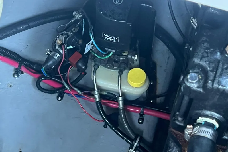 Slide: The Image of Engine compartment of 2001 Chaparral Signature 260 boat with hydraulic components. - 34