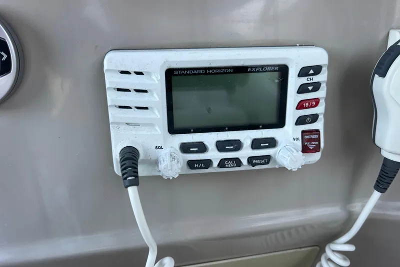 Slide: The Image of Standard Horizon Explorer radio on 2001 Chaparral Signature 260 boat dashboard. - 35