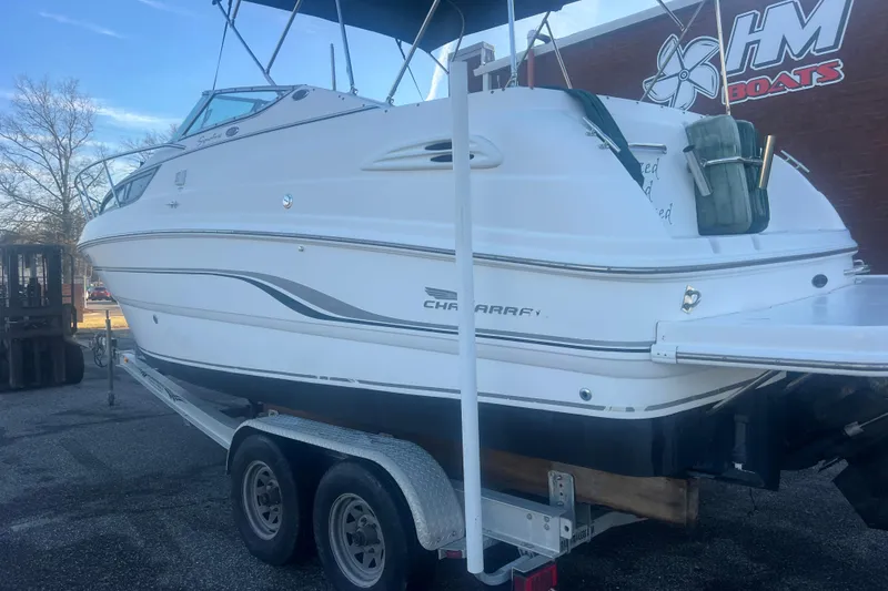 Slide: The Image of 2001 Chaparral Signature 260 boat on trailer at HM Boats dealership. - 4