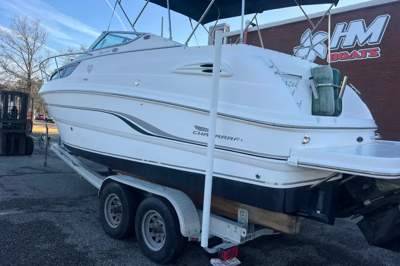 Slide: The Image of 2001 Chaparral Signature 260 boat on trailer at HM Boats dealership. - 40
