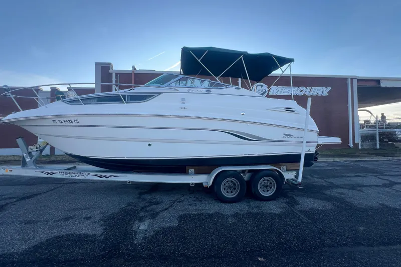Slide: The Image of 2001 Chaparral Signature 260 boat on trailer, parked near Mercury building. - 41